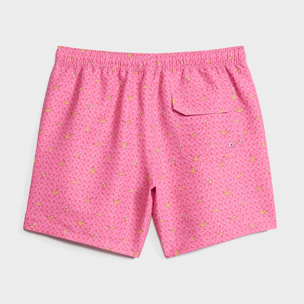 PEEL PARTY swim shorts by PUBLIC BEACH SWIM feature a playful yellow banana print, elastic waistband, quick-dry fabric, and a right back pocket with button closure. Shown on a plain white background.