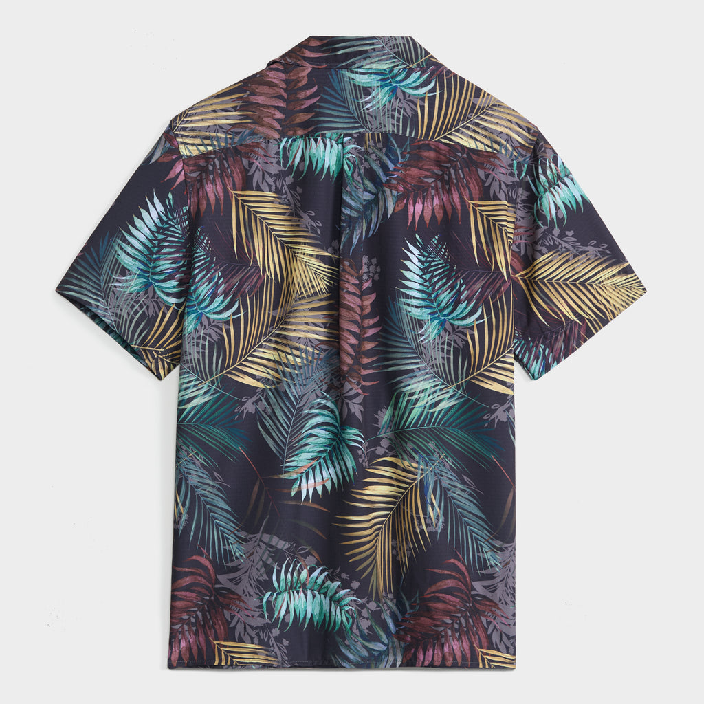 The BOTANIC BURST SHIRT by PUBLIC BEACH SWIM features a vibrant palm print in green, yellow, purple, and teal on a dark background—shown from the back and perfect for effortless summer style.