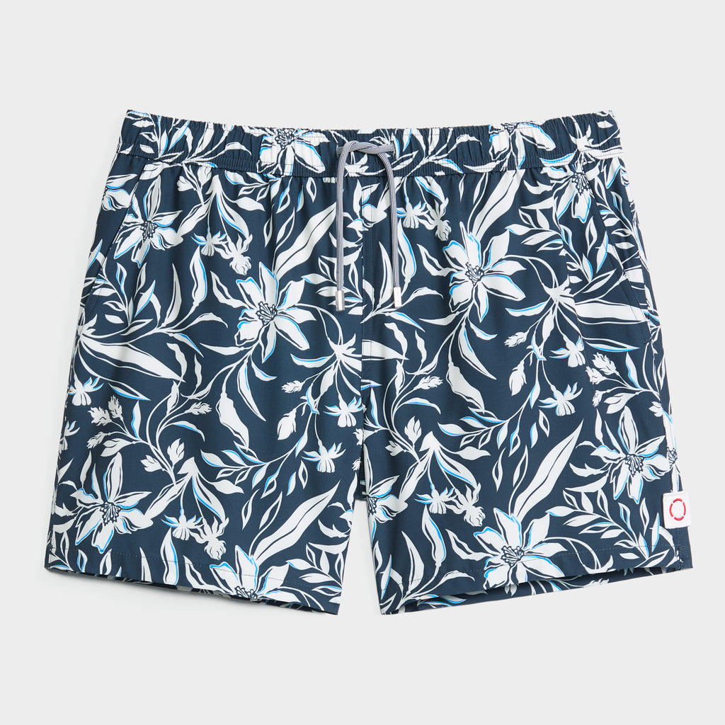 PUBLIC BEACH SWIM's FLORAL IVY men's swim shorts feature a navy blue base with white and light blue floral ivy print, an elastic drawstring waistband, and quick-dry fabric—perfect for any aquatic adventure.