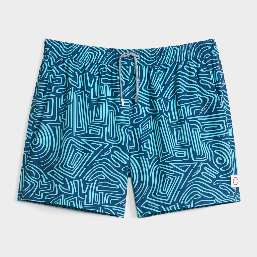 PUBLIC BEACH SWIM's TWISTED PATH swim shorts feature a light blue and turquoise maze-like pattern, white drawstring waistband, a small white patch on the right leg, and quick-dry fabric—perfect for beach days.