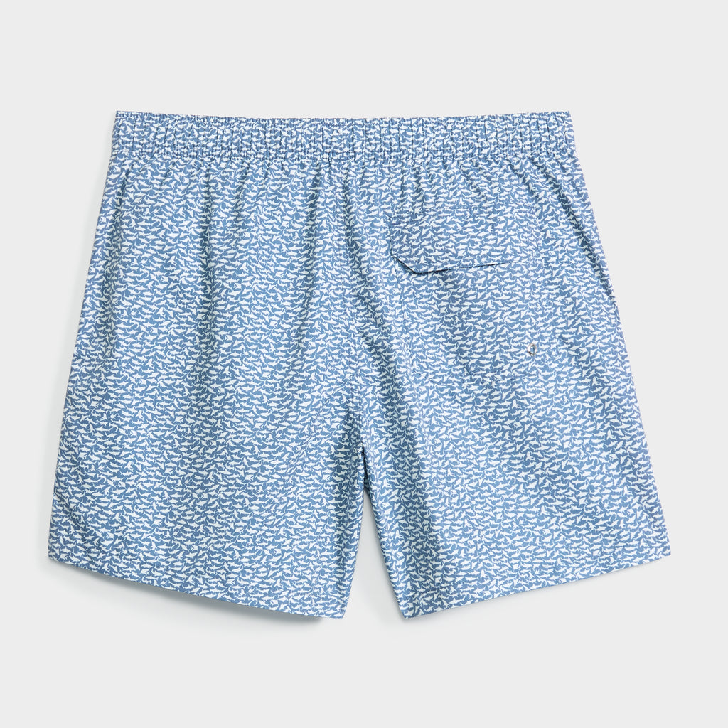 The JAWSOME swim shorts by PUBLIC BEACH SWIM feature a light blue color with white fish print, a quick-dry fabric, elastic waistband, and a small side pocket with flap. Shown laid flat on a plain white background.