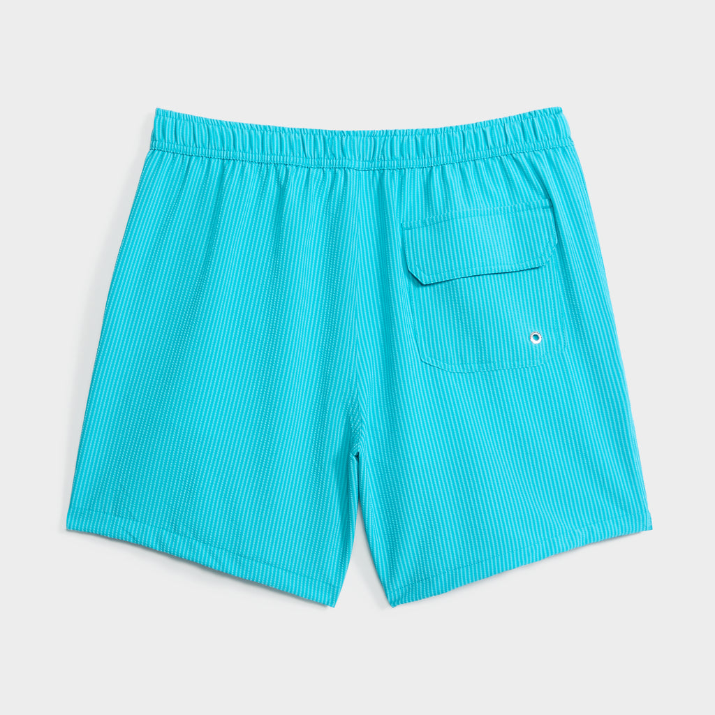 The SAINT TROPEZ men’s swim shorts by PUBLIC BEACH SWIM feature bright turquoise fabric, thin white stripes, an elastic waistband, and a flap pocket with grommet—stylish quick-dry trunks perfect for beachwear.