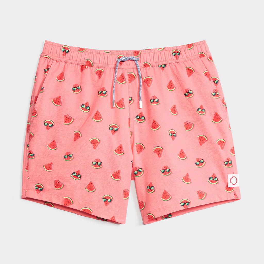 The SUNNY MELONS men’s swim shorts by PUBLIC BEACH SWIM feature a fun pink watermelon and sunglasses print, quick-dry fabric, drawstring waistband, and a small white patch on the left leg.