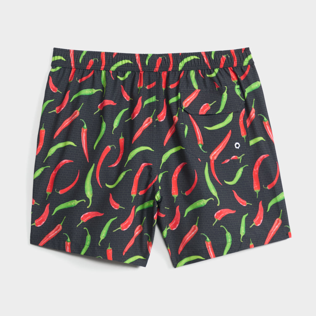 The HOT PEPPERS swim shorts by PUBLIC BEACH SWIM feature a vibrant red and green chili pepper print, an elastic waistband, and quick-dry fabric for comfort in and out of the water.