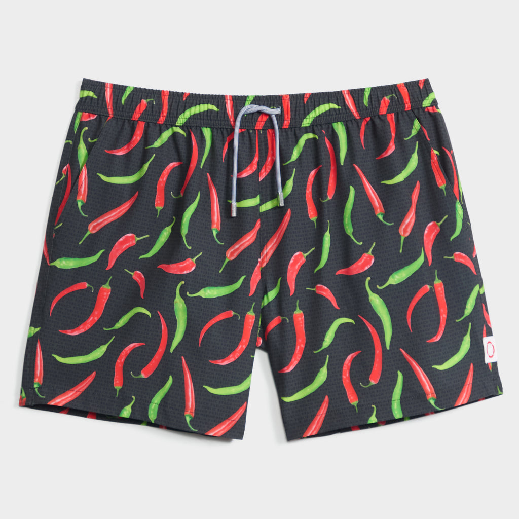 The PUBLIC BEACH SWIM HOT PEPPERS men’s swim shorts feature a bold chili pepper pattern on black, a white waist drawstring, and quick-dry fabric for all-day comfort.